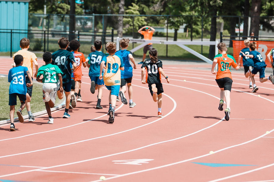 Active youth running on a track